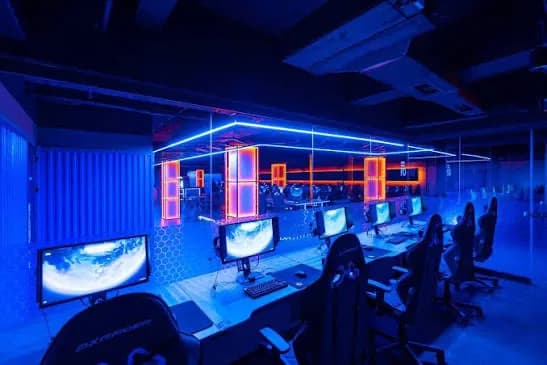A gaming room lit in blue and red.