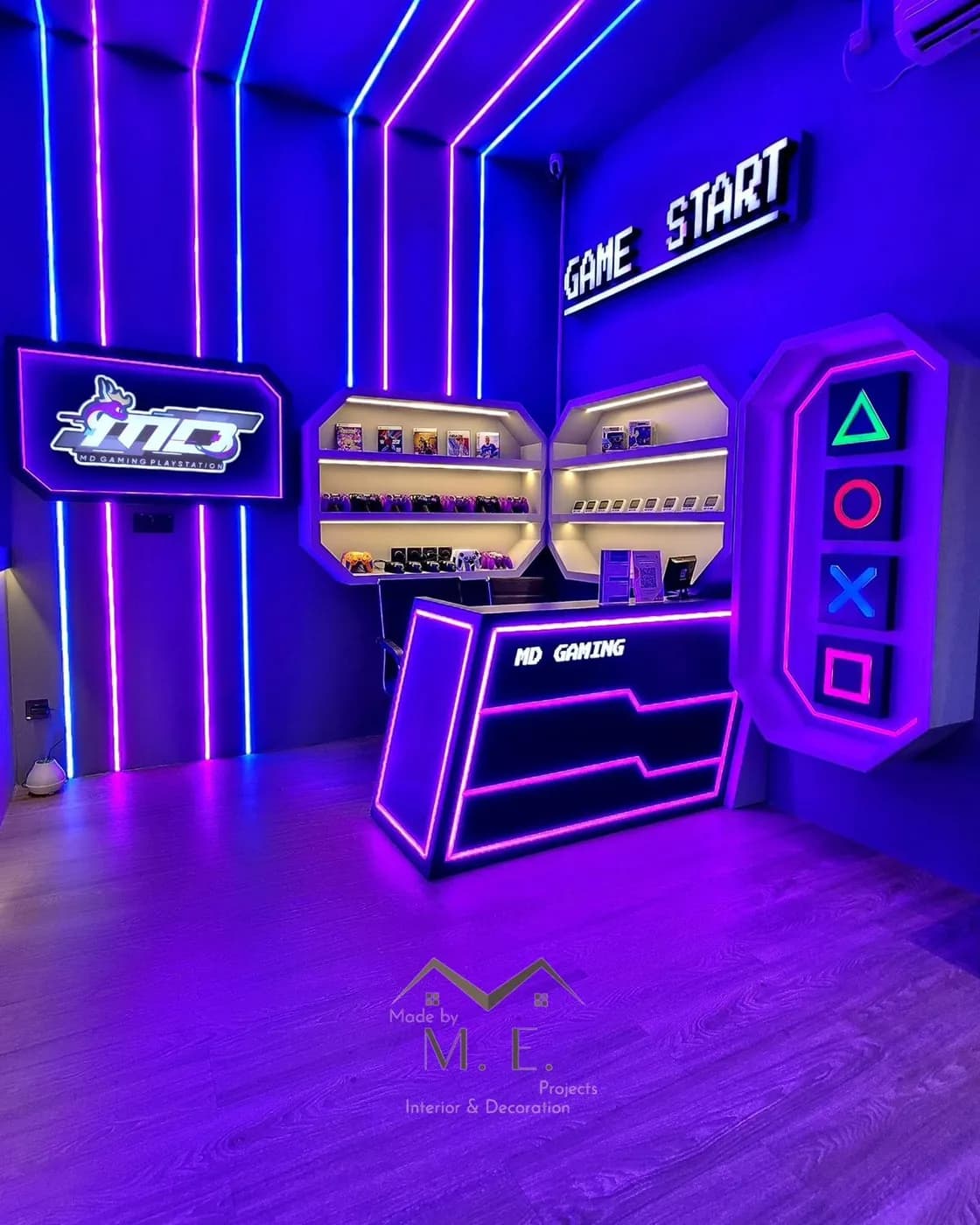 A neon gaming reception desk with shelves of accessories.